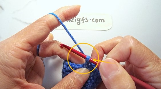 Pull through both loops on the hook, leaving one loop remaining.