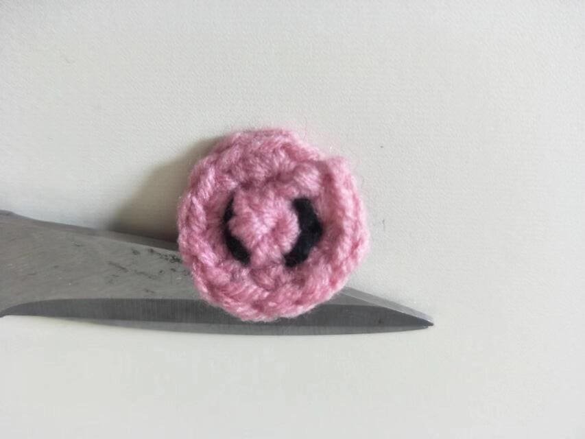 Use black yarn to crochet the nostrils