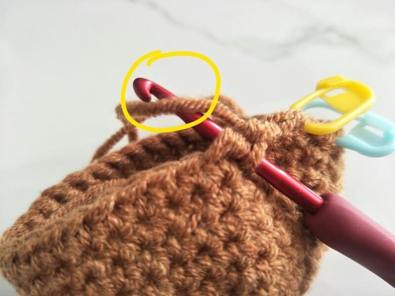Yarn over and pull through both front loops.