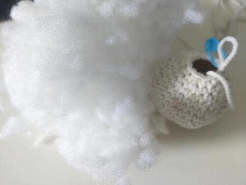 fiberfill into the body of pig crochet