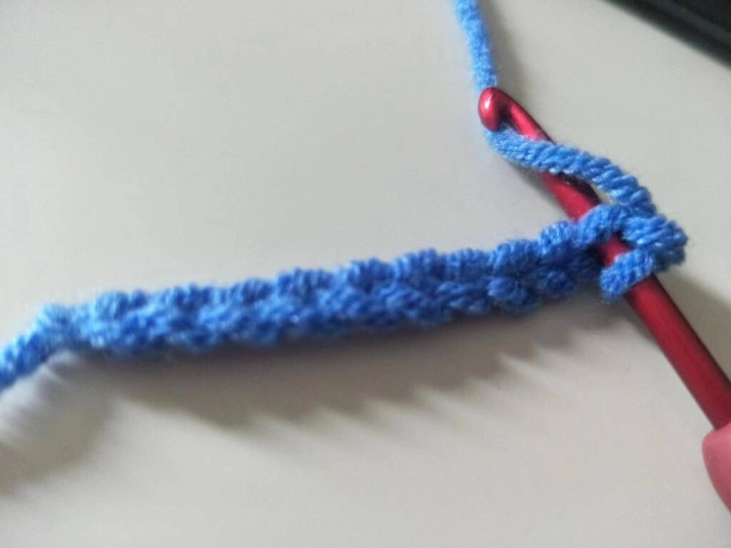 the first yarn over for single crochet stitch