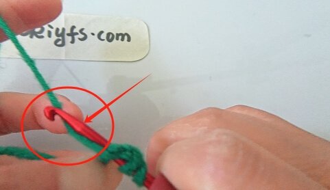 Wrap the yarn around the hook.