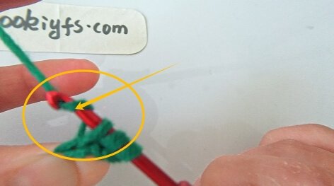 Wrap yarn around hook
