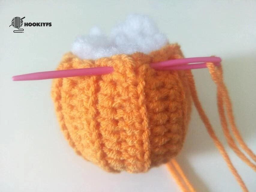 Start sewing the first of another side for crochet pumpkin pattern