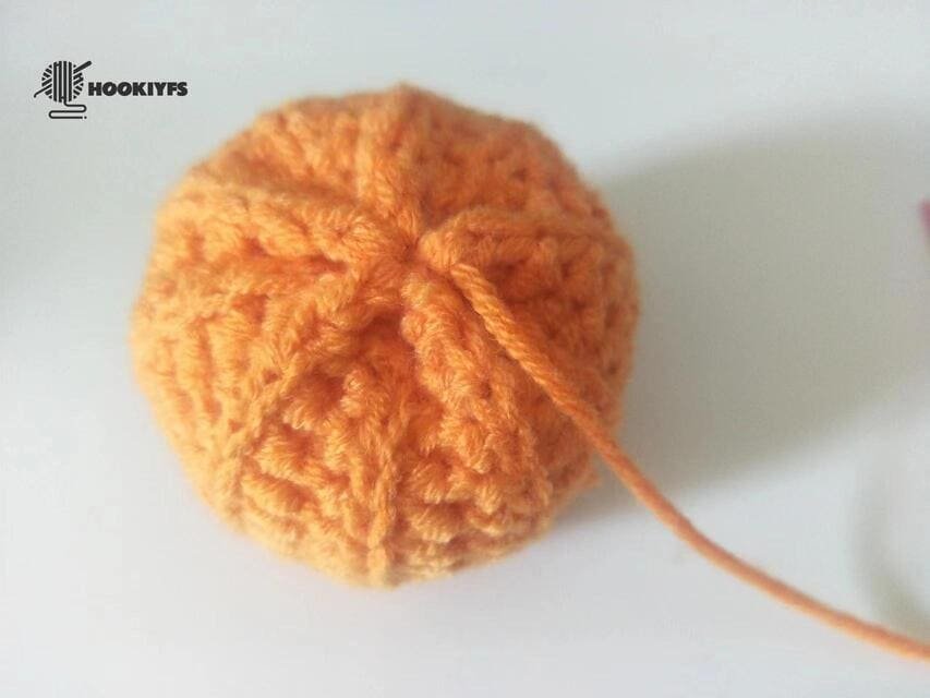 Start sewing the second of another side for crochet pumpkin pattern