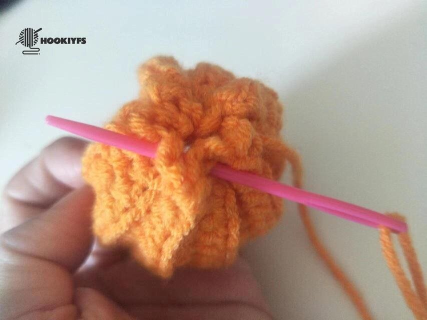 Start sewing the second of the one side for crochet pumpkin pattern