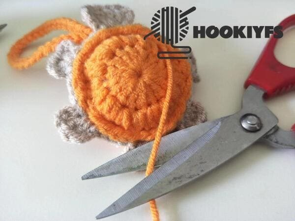 cut yarn end and conceal end again