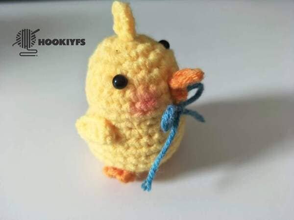 glue the butterfly knot on the body for duck crochet