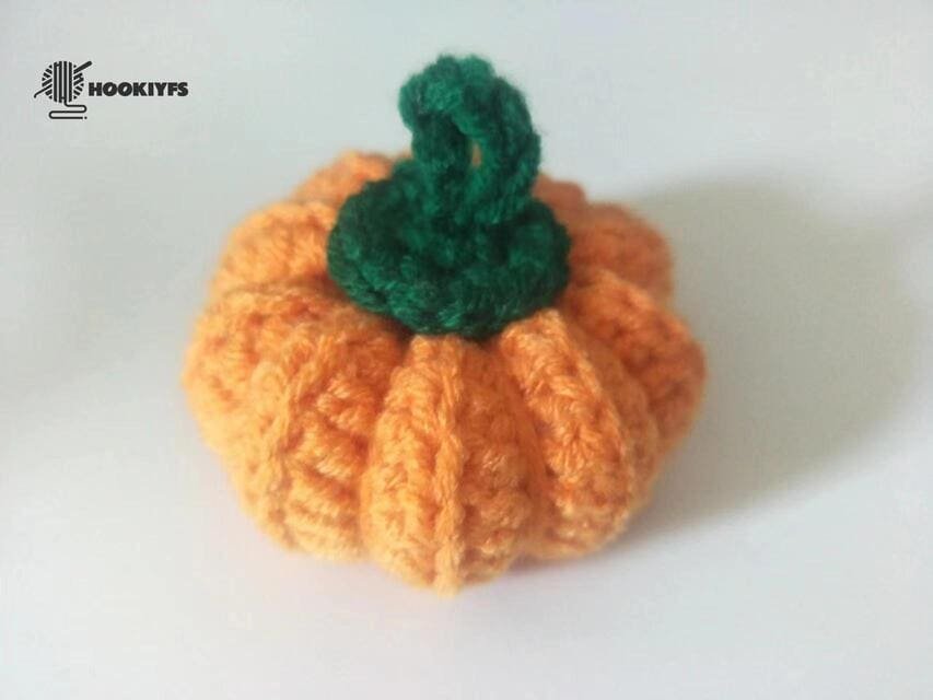 glue the leaf on the body for crochet pumpkin pattern