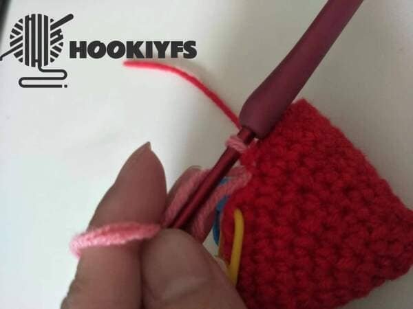 pink yarn of loop is completed of strawberry crochet
