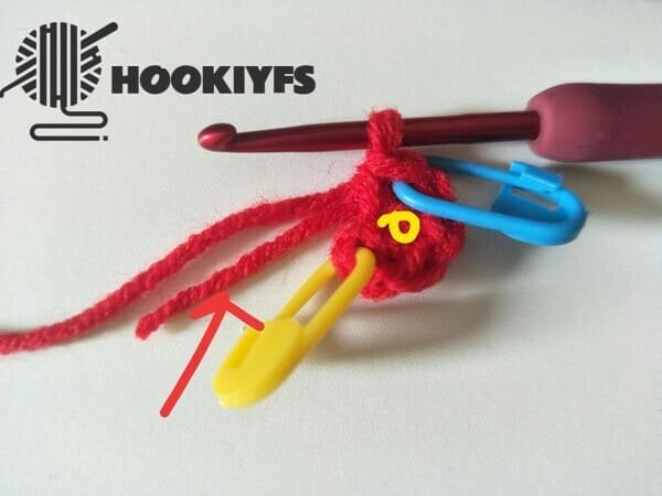 pull off yarn end of magic ring for strawberry crochet