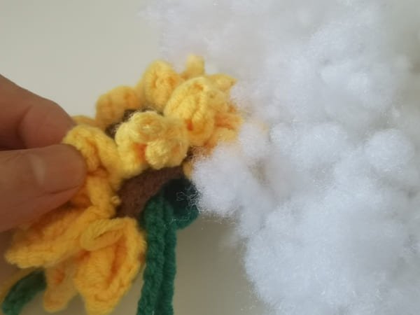 put fiberfill in to hole of sunflower when two petals left