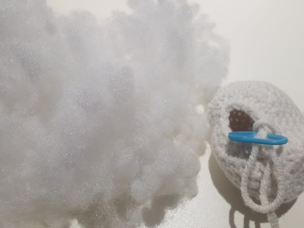 put the fiberfill in to the head of hello kitty
