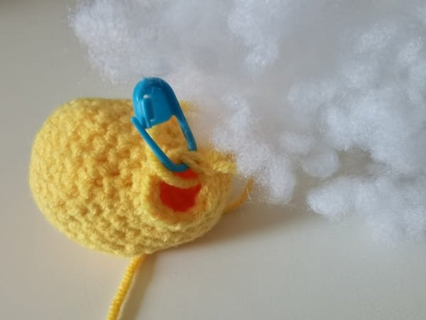 put the fiberfill in to the hole of mango
