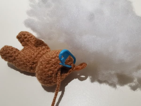 put the fiberfill in to the hole of teddy bear body