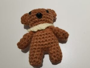 safe mouth and sew the eyes on the body of teddy bear crochet