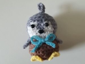 safety eyes and glue the butterfly knot on the body of penguin
