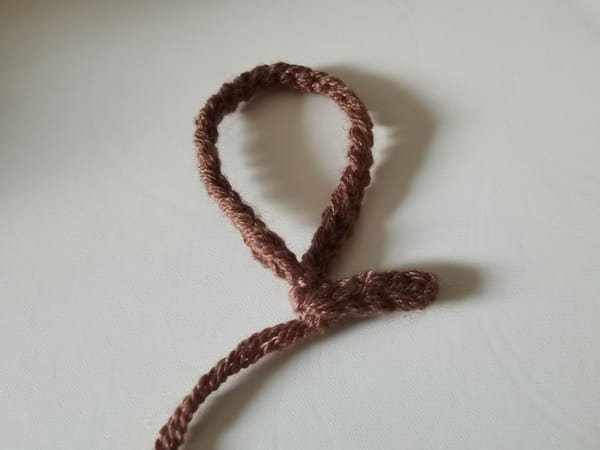sew the hand carrying with yarn needle