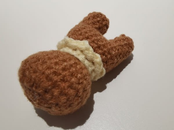 sew the necklace on the body of teddy
