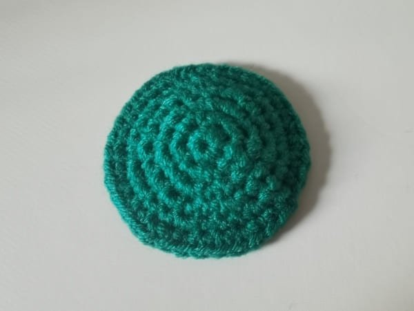 the dark green fabric is completed for sunflower crochet