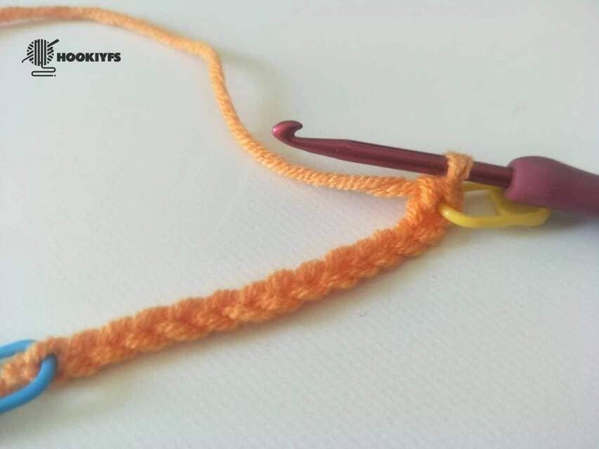 the first half double crochet is completed for round 1 for crochet pumpkin pattern.