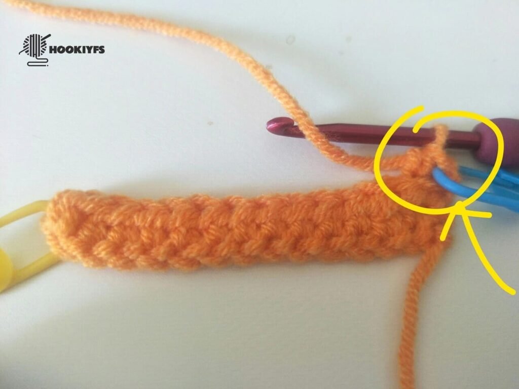 the first half double crochet is completed for round 2 for crochet pumpkin pattern
