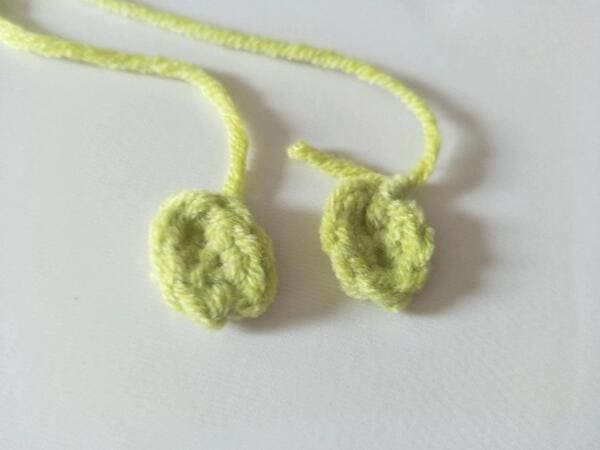 two piece of arm are completed for crochet frog pattern