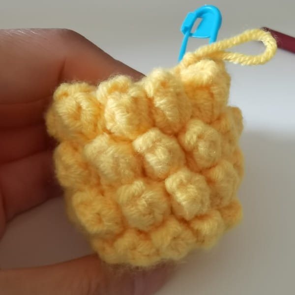 view of pineapple on the hand for round 6