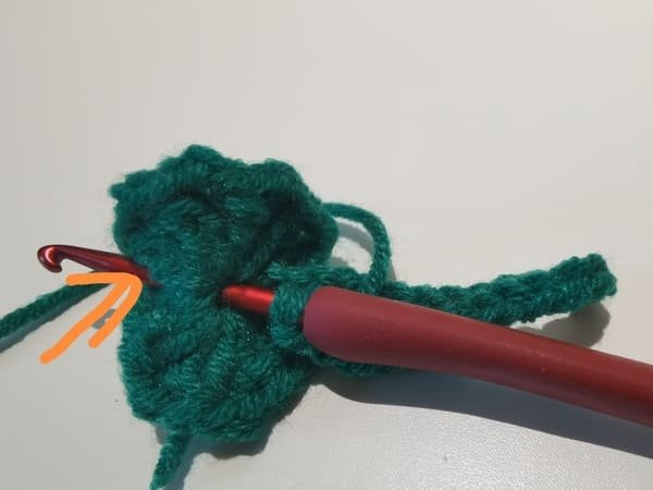 Insert the hook from the fabric on the left