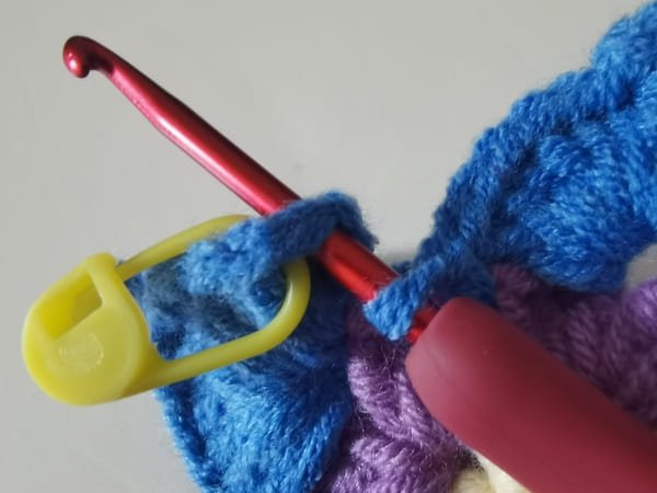 hook insert the first stitch for round 3 for crochet butterfly pattern