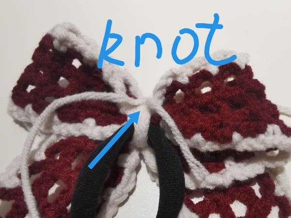 make knot several times at the back of fabric