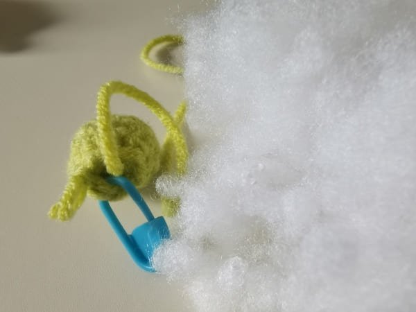 put fiberfill in to pea for crochet peas in a pod