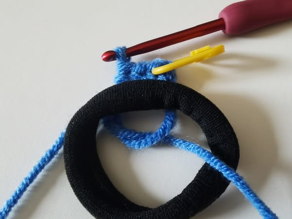 put the black hair rope on the fabric