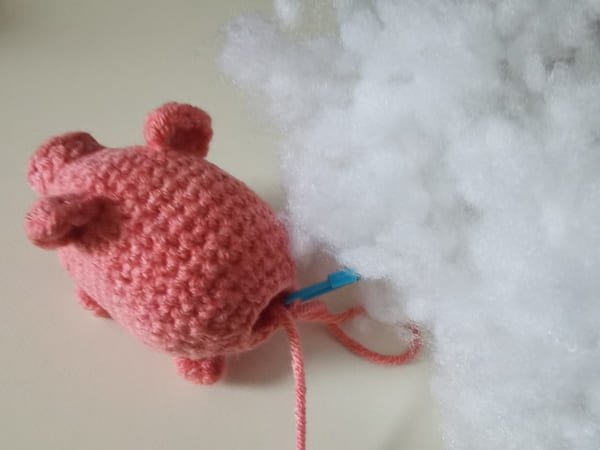 put the fiberfill into the hole of pig body
