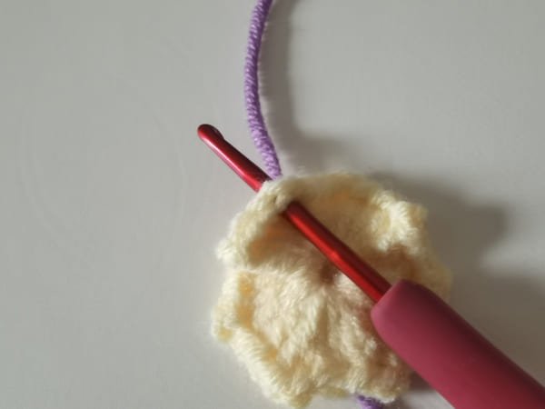 put the purple yarn for round 2 for crochet butterfly pattern