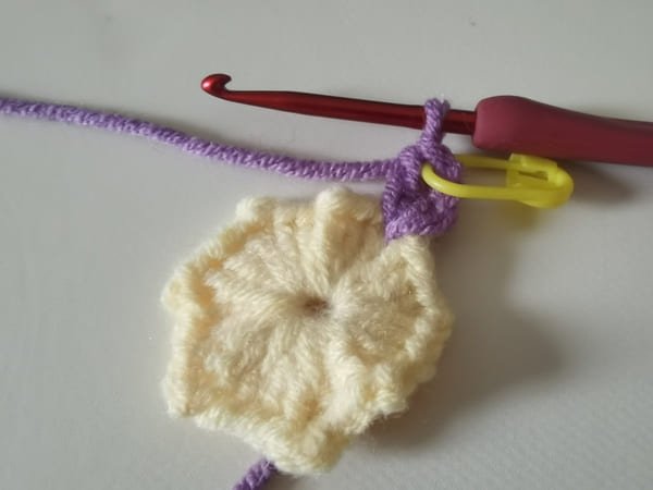 the first double crochet for round 2 for crochet butterfly pattern