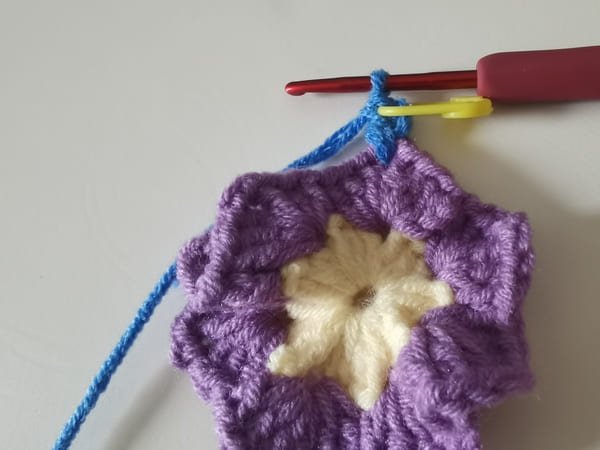 the first double crochet for round 3 for crochet butterfly pattern