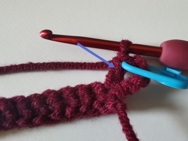 the first double crochet is completed for round 2 for crochet rose pattern