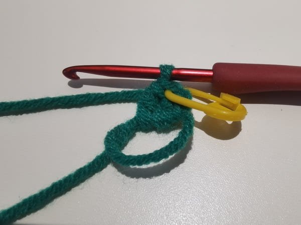 the first puff is completed with yellow marker for grape crochet
