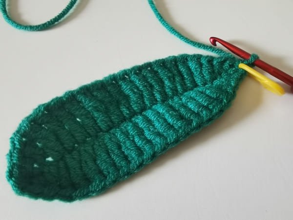 the first single crochet for round 2 for pea pod