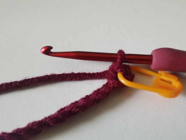 the first single crochet is completed for crochet rose pattern