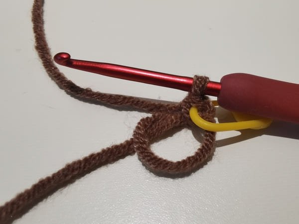 the first single crochet with yellow marker for sunflower hair rope crochet pattern