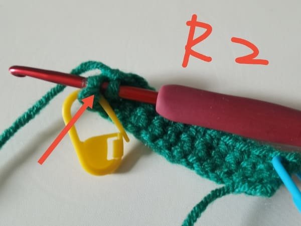 the hook insert the first stitch at the previous round for last single crochet