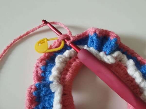 the hook insert the first stitch for round 4