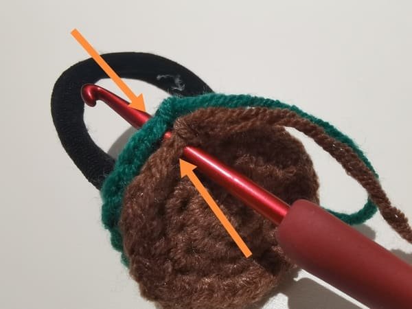 the hook insert the stitch of two fabric