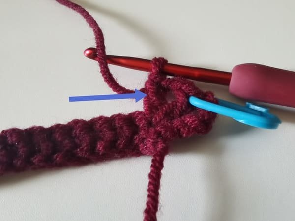 the second double crochet is completed for round 2 for crochet rose pattern