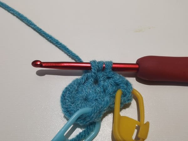 three loops on the hook for the next half double stitch in same hole