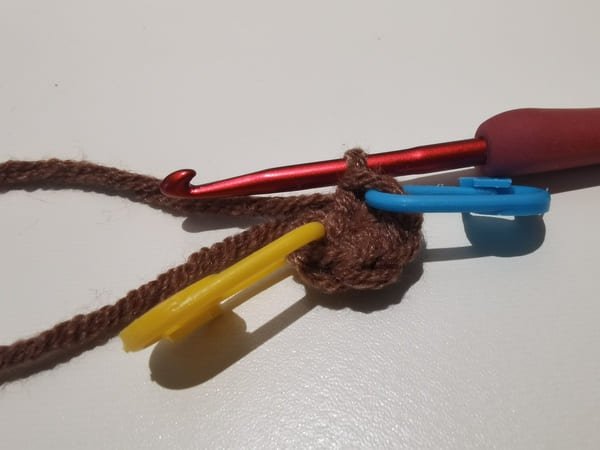 tighten up the yarn end for magic ring
