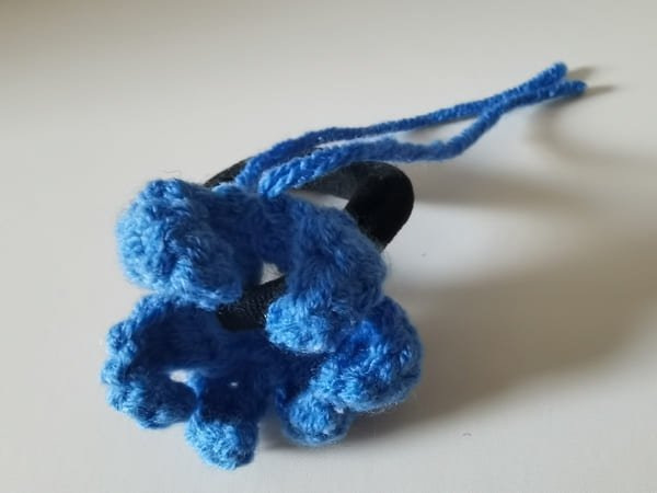 use the hook to bring out yarn end