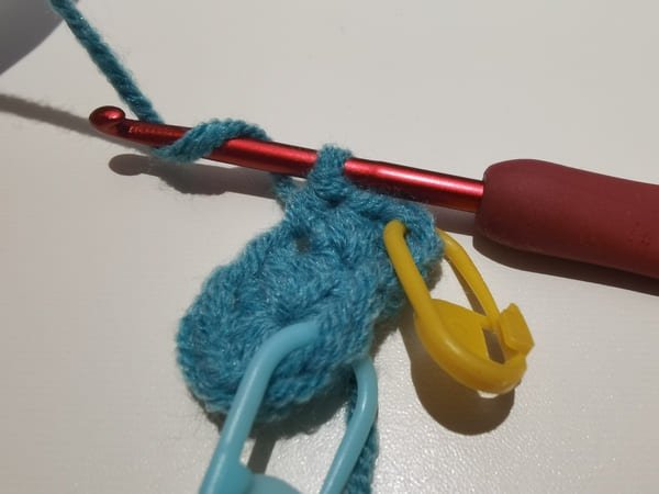 yarn over for the next half double stitch in same hole